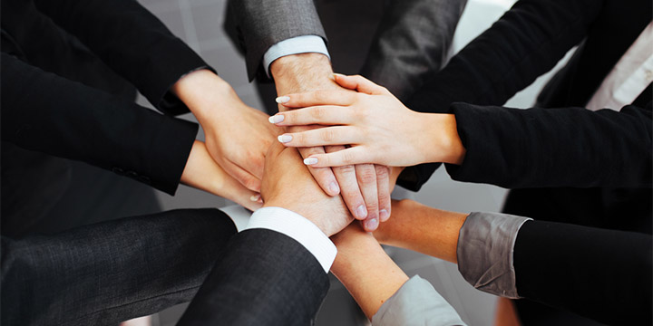 Business people joining hands